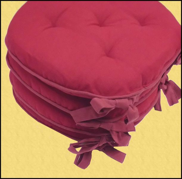 cuscini on line  con colori di tendenza arancione rosso azzurro vinaccia bianco per le sedie rotondi che arredano